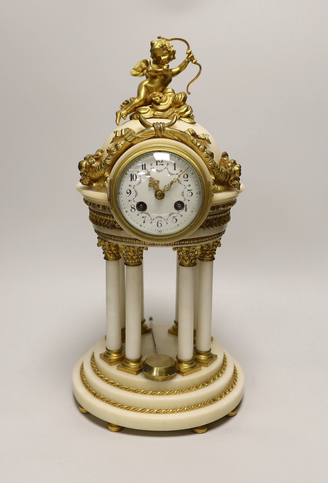 An early 20th century French alabaster and ormolu mantel ‘cupola’ clock with pendulum, 39cm tall